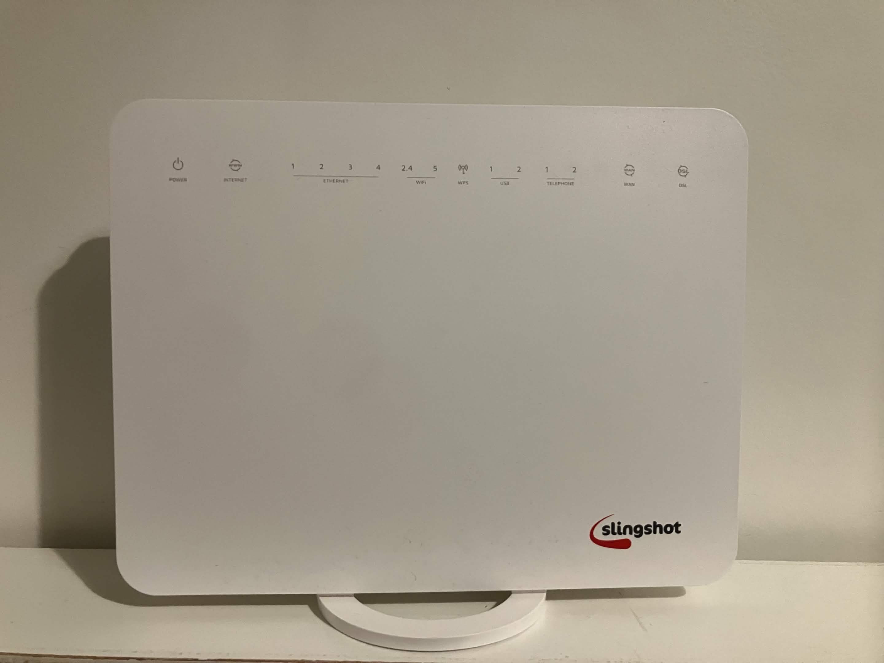 The front of the NF18MESH router with shell